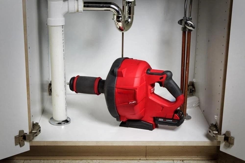 Step-by-step setup guide for Milwaukee M18 drain snake review pros cons including battery installation and cable loading